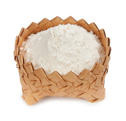 Fresh flour isolated in a wicker basket