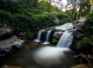 Small waterfall flowing from a creek