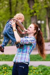 Obraz premium Happy mother with the baby playing