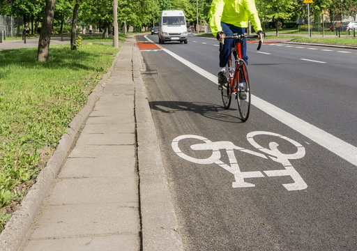 Fototapeta Bicycle path, cyclist, traffic lane - Red, white road marking