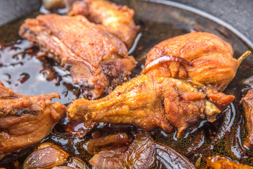 Deep fried chicken drumsticks over white background