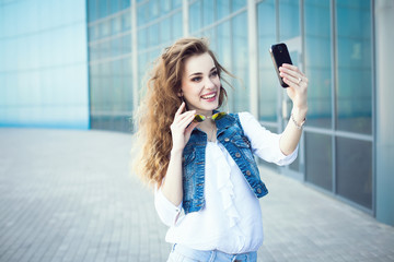 Technology internet and happy people concept - beautiful girl ta