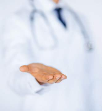 Male Doctor Holding Something In His Hand