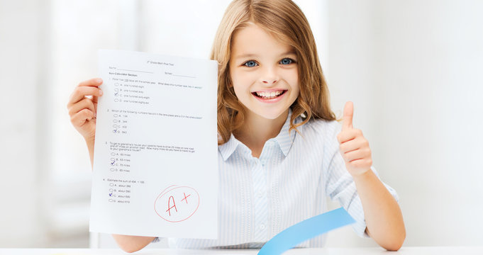 girl with test and grade at school