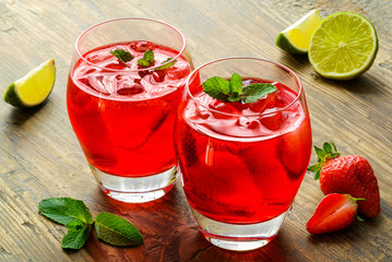 Cold strawberries drinks with strawberry slices and mint
