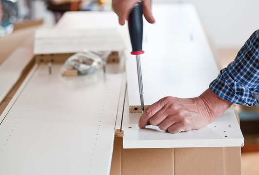 Man Assembling Flat Pack Furniture