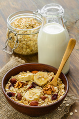 Healthy breakfast - whole grain muesli with a banana and nuts