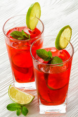 Cold strawberries drinks with strawberry slices and mint