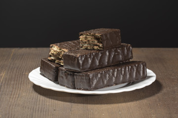 chocolate wafers on a black background