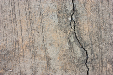 Cement floors are old and dirty.