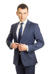 Businessman buttoning his suit jacket