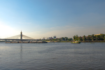 Fototapeta premium Boats carrying sand. chaophraya River, Nonthaburi, Thailand