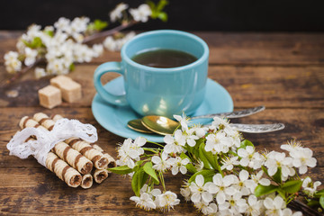 wafers, tea and flowers of cherry