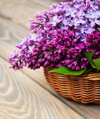 Basket with lilac flowers
