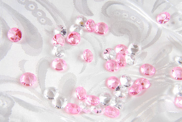 white and pink diamonds on white fabric
