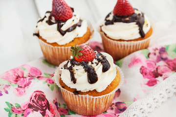 Delicious cream and strawberry cupcakes