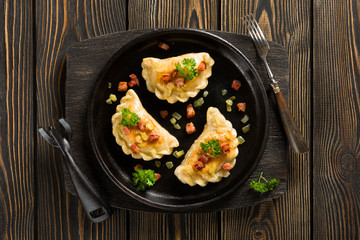 Fried dumplings with onion and bacon top view - 83258543