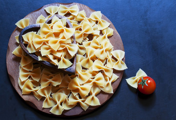 Dry Italian pasta farfalle, selective focus