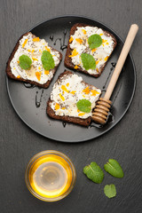 bruschetta with goat cheese, honey and chia seeds. top view