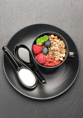 Granola with yogurt, honey and berries. top view