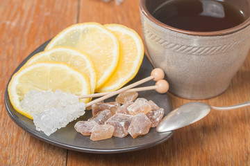 chrystal sugar with lemon and tea