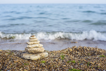 Balanced stones on a beach 