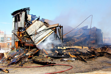 Fototapeta premium Old wooden residential house after a fire