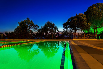 sunset at pool area with trees