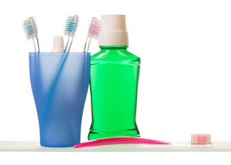 Toothpaste and toothbrushes on shelf
