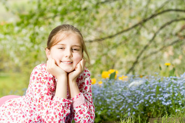 Outdoor portrait of cute little girl on the meadow