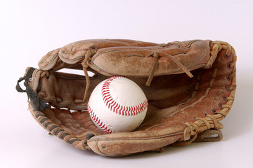 baseball glove and balls on white background