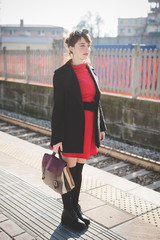 young beautiful red dressed vintage hipster woman