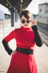 Obraz premium young beautiful red dressed vintage hipster woman