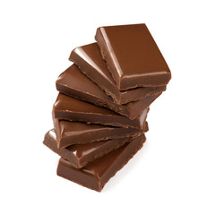Stack of broken milk chocolate bars close up