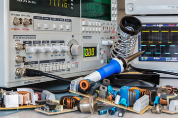 various power supplies in a test lab ready for repair