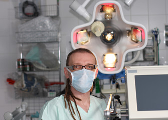 Obraz na płótnie Canvas Portrait of male nurse ICU with tattoo and dreadlocks.