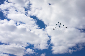 10 aircrafts as a triangle in a sky