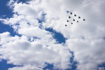 10 aircrafts as a triangle in a sky