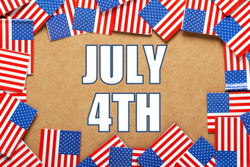 The date July 4TH with a border of USA flags