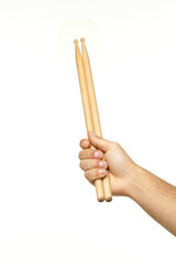 Male hands holding drum sticks.isolated backgrund