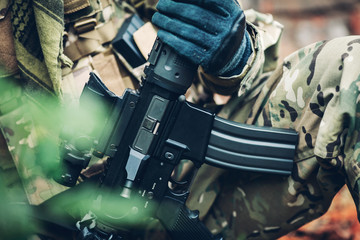 soldier holding  weapon M4 carbine