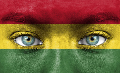 Human face painted with flag of Bolivia