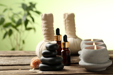 Beautiful spa composition on wooden table, on green background