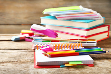 Fototapeta premium Bright school stationery on old wooden table