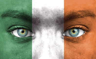 Human face painted with flag of Ireland