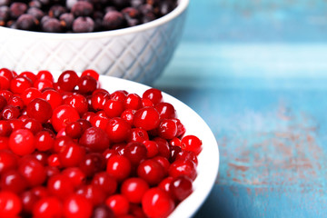 Blackberry with cranberries in bowls close up