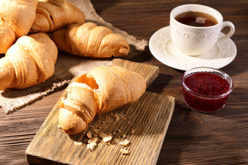 Delicious croissants on table close-up