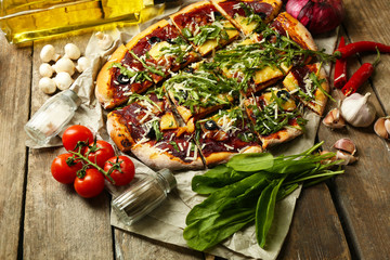 Tasty pizza with vegetables on table close up