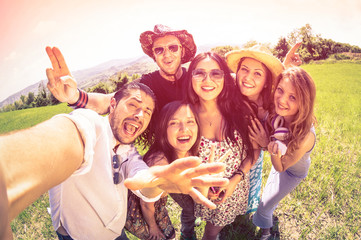 Best happy friends taking selfie at countryside picnic