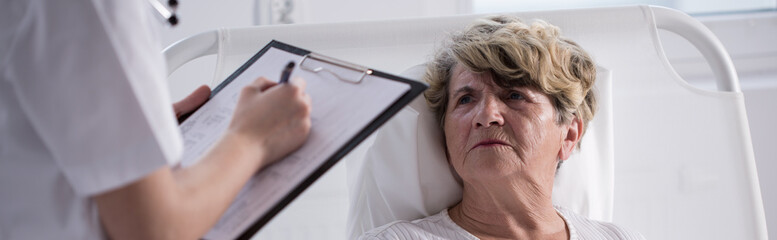 Unhappy woman staying in hospital